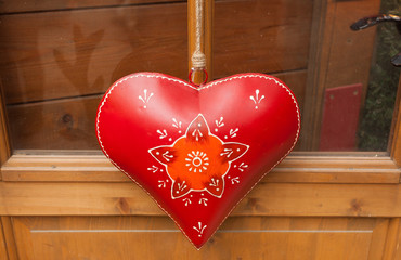 Heart hand decorated in Christmas style.