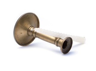 Old candle and vintage bronze candlestick