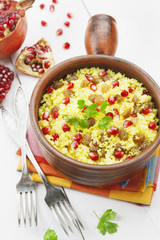 Couscous with pomegranate, raisins and spices