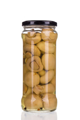 Marinated mushrooms in glass jar.