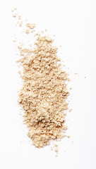 Finishing face powder on white background