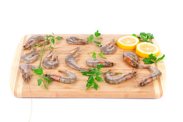 Fresh shrimps on wooden board.