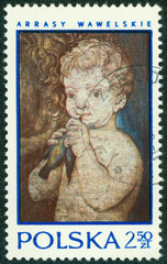 stamp printed in Poland shows Tapestry "Child holding bird"