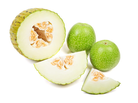 Sliced melon and green apples isolated on white background.