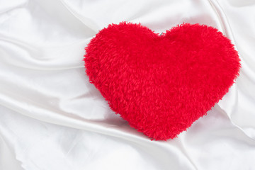 red heart on white cotton