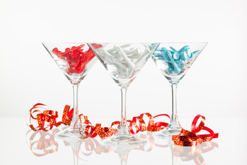 Three glasses of champagne and golf equipments