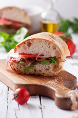 Italian focaccia with tomato, prosciutto and mozzarella