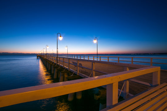Beautiful colorful Sunrise on the pier at the seaside