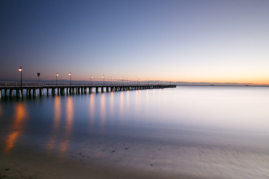 Beautiful colorful Sunrise on the pier at the seaside