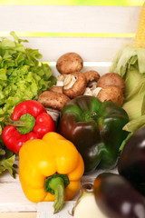Vegetables on white wooden box background