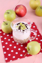 Oatmeal with yogurt in pitcher and apples