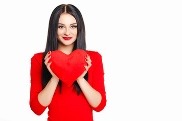 Portrait of a beautiful woman with red heart in hands.
