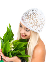 blond girl with a bouquet of lilies of the valley