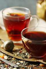 Beautiful vintage composition with herbal tea, on wooden table
