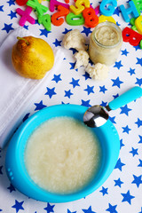Fresh baby food in bowl with spoon