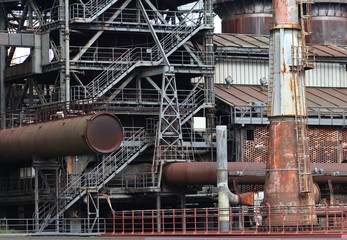 The flanges and old metal constructions in industrial zone © northernland