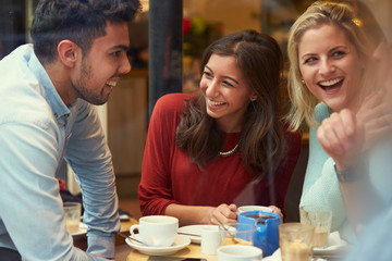 Group Of Friends In Caf‚ Relaxing Together