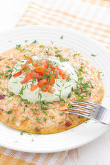 dietary omelette with carrot and green yogurt sauce, vertical