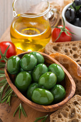 green and black olives, olive oil and ciabatta