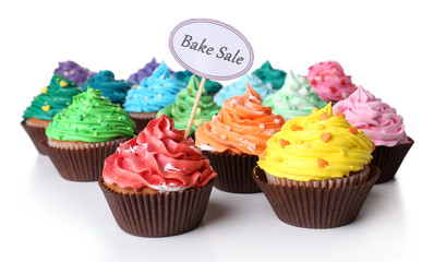 Delicious cupcakes with inscription isolated on white