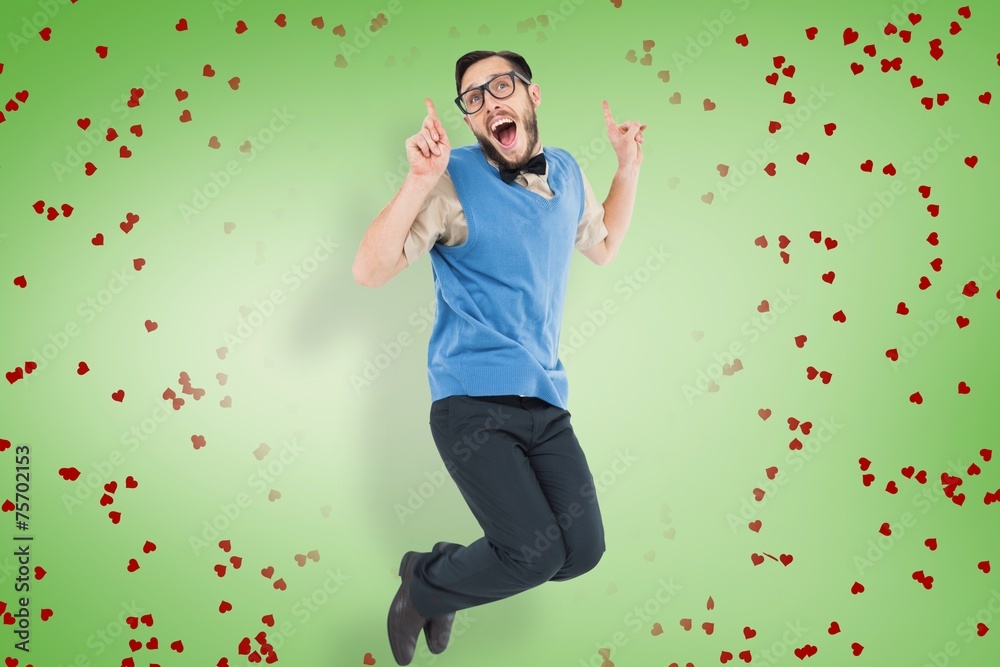Leinwandbilder Composite image of geeky hipster jumping and smiling