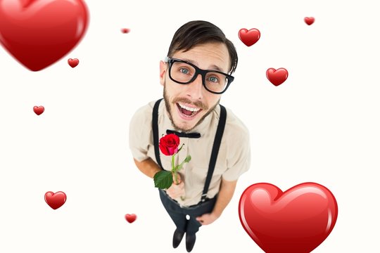 Composite image of geeky lovesick hipster holding rose