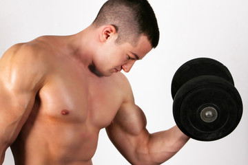 Fototapeta na wymiar Bodybuilder training hard