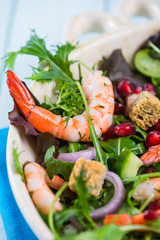 Fresh salad with shrimps and pomegranade seeds