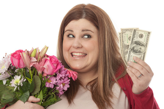 Selfish Woman Holding Flowers And Dollars