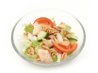 Pasta salad with chicken in a glass bowl