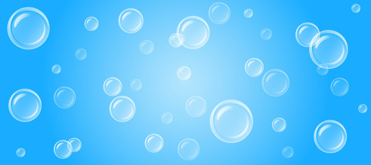 large and small transparent soap bubbles