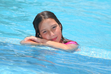 Fototapeta na wymiar happy girl in a swimming pool