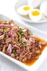Thai traditonal food spicy minced chicken salad and vegetable