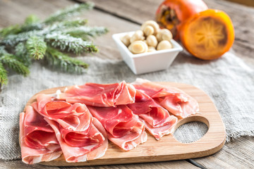 Slices of jamon on the wooden board