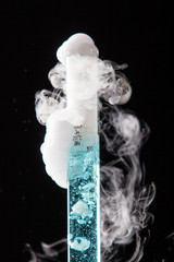 Chemical reaction of blue liquid in raduated cylinder