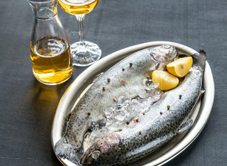 Fresh trouts in ice on the vintage metal tray