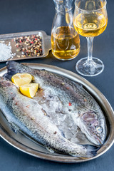 Fresh trouts in ice on the vintage metal tray