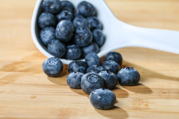 Blueberry  on a spoon concept for healthy eating and nutrition