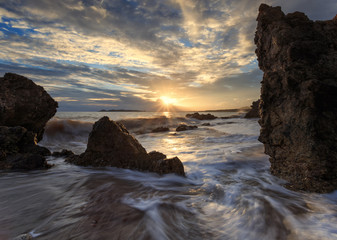 Beautiful sunset at the stone beach