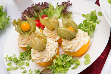 Dish with stuffed peach and cherry