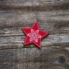 Fototapeta na wymiar christmas handmade decoration, red wooden star