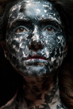 art photo of a beautiful woman with black and white face art