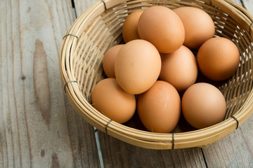 Eggs in the Basket on wooden table