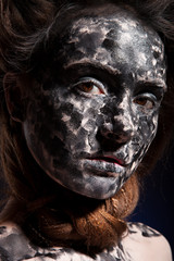 Obraz premium art photo of a beautiful woman with black and white face art