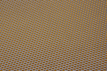 Metal surface with holes, industrial background 