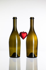 Empty bottles of wine and love symbol