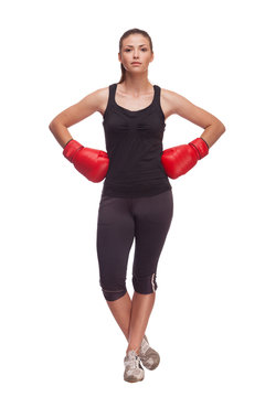 sport young woman with red gloves going to fighting