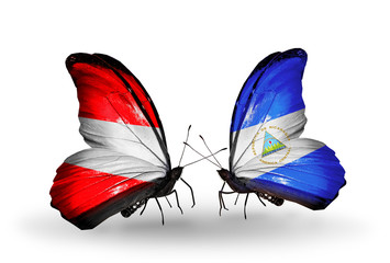 Two butterflies with flags Austria and Nicaragua