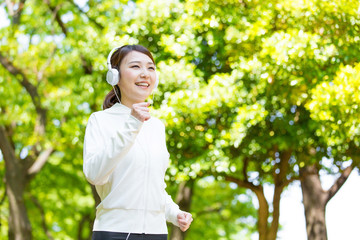 young asian woman running in the park