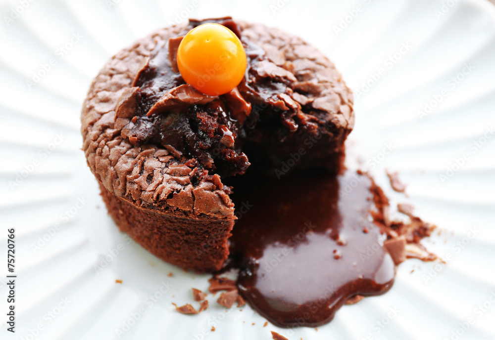 Wall mural hot chocolate pudding with fondant centre on plate, close-up